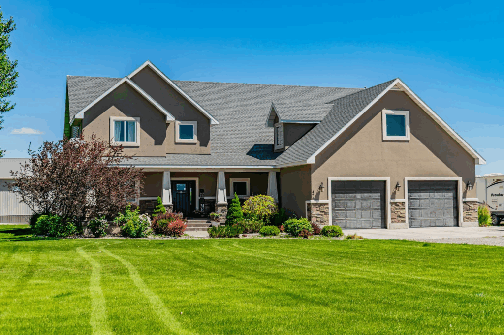 Picture of home with green yard and a new roof by NXT LVL